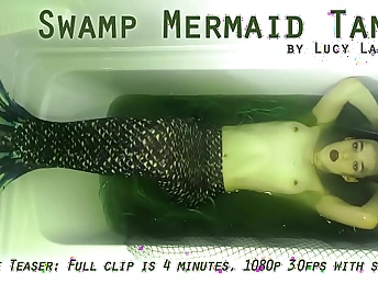 Lucy LaRue plays the operate a Swamp Mermaid Tank close by a super-hot solo attempt fun